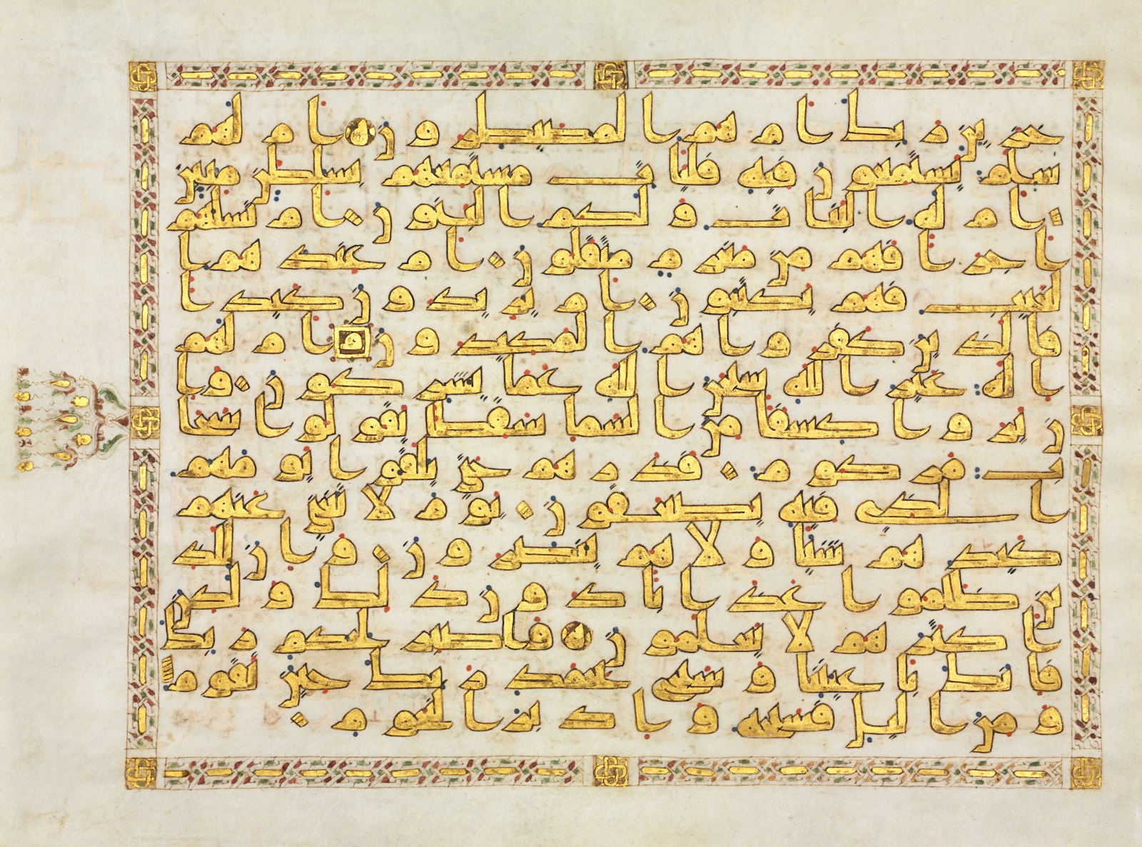 An ornate manuscript with gold Arabic calligraphy